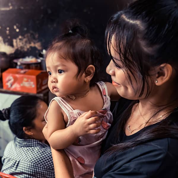 mother and child in a small street