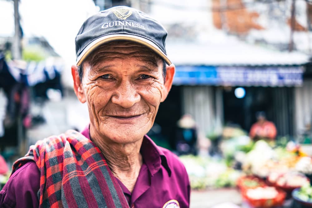 Smiling and cooking Phnom Penh street Photo Tour